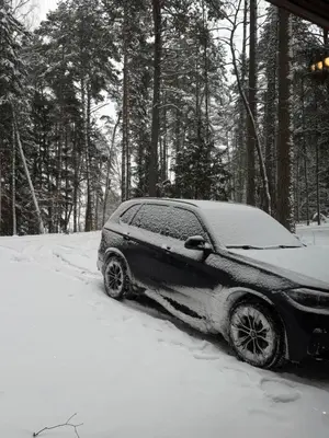 a car parked in the snow in the woods at Atgal i gamta in Ukmergė