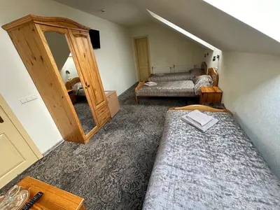 a bedroom with a mirror and a bed in a room at Keta in Marijampolė