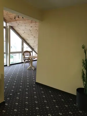an empty office with a table and chairs in a room at Keta in Marijampolė