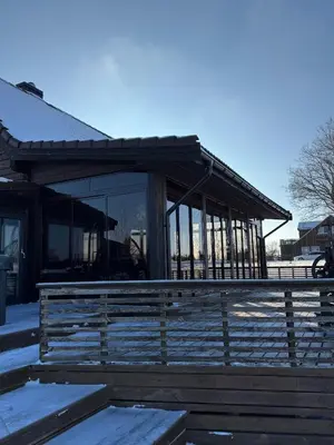 a building with a fence in front of it at Pakarklių sodyba in Šeiminiškiai