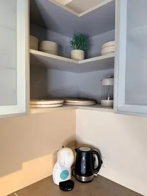 a kitchen counter with a coffee pot and a tea kettle at Premium 1-Bedroom Apartment in Vilnius Center with Self Check-in in Vilnius