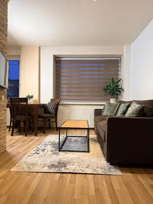 a living room with a couch and a table at Premium 1-Bedroom Apartment in Vilnius Center with Self Check-in in Vilnius