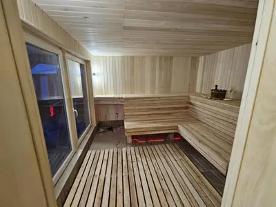 an empty sauna with a window in a room at Šaltenių pašvaistė