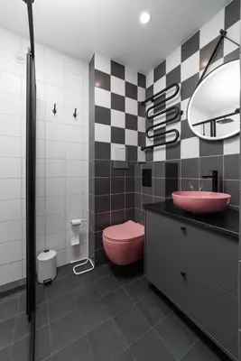 a bathroom with a pink toilet and a sink at Stilinga studija su visais patogumais in Šiauliai
