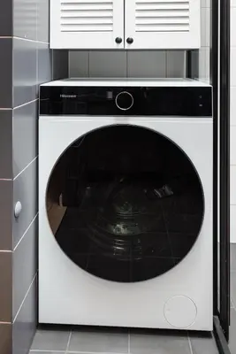 a black and white dishwasher in a kitchen at Stilinga studija su visais patogumais in Šiauliai