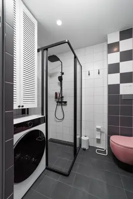 a bathroom with a shower and a pink toilet at Stilinga studija su visais patogumais in Šiauliai