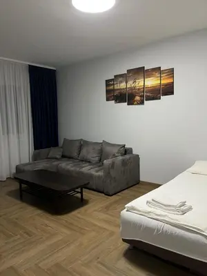 a living room with a couch and a coffee table at Kerulis Apartments in Vilnius