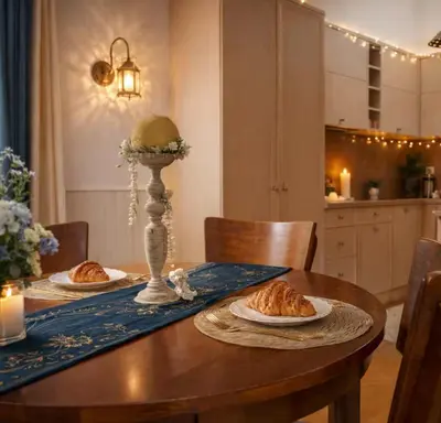 a dining room table with plates of food on it at Cosy Place in Old Town in Vilnius