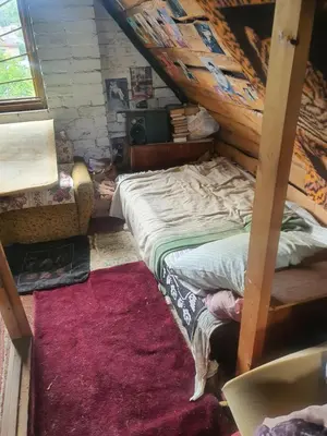 a bedroom with a bunk bed and a rug at Hostel in Rudamina