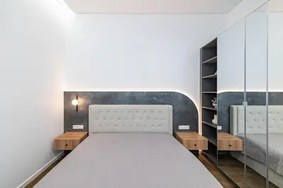 a bedroom with a bed and a mirror at Vytauto 43 Residence 6 by Domvia in Kaunas