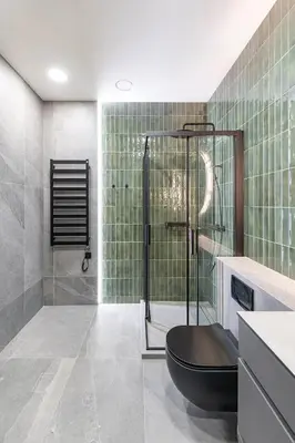 a bathroom with a shower with a black toilet at Vytauto 43 Residence 6 by Domvia in Kaunas