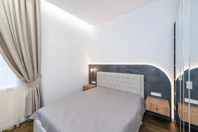 a small bedroom with a bed and a window at Vytauto 43 Residence 6 by Domvia in Kaunas