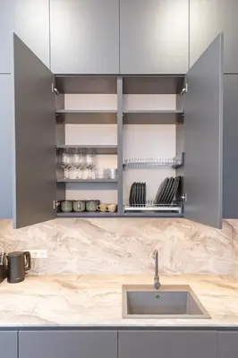 a kitchen with stainless steel cabinets and a sink at Vytauto 43 Residence 6 by Domvia in Kaunas