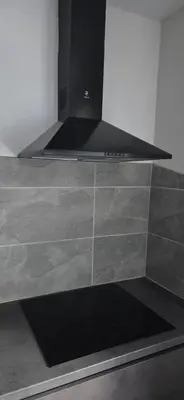 a kitchen with a counter top with a stove at Studio Ap in Visaginas