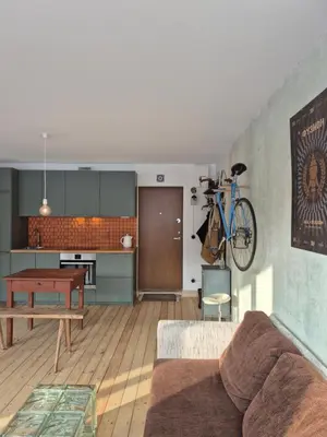 a living room with a couch and a table at Nordhouse in Šiauliai