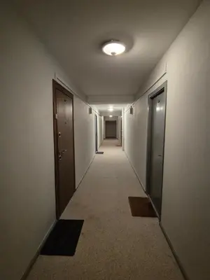 a hallway of an office building with a long corridor at Nordhouse in Šiauliai