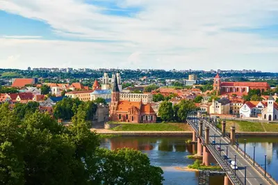 a city with a bridge over a river at Cozy and quiet apartment near the city in Kaunas