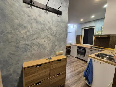 a kitchen with a sink and a counter top at Valdau NT in Kaunas