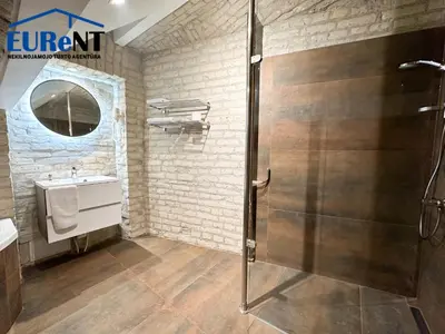 a bathroom with a shower and a sink at Green apple - Self check-in - Free parking in Vilnius