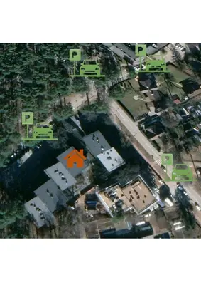 an aerial view of a city with a orange house at Cozy Riverside Apartment in Birštonas