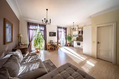 a living room with a couch and a table at Guido apartament in Šiauliai