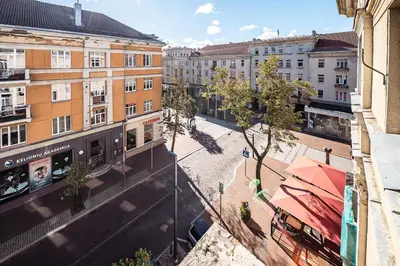 a view of a city street with buildings at Guido apartament in Šiauliai