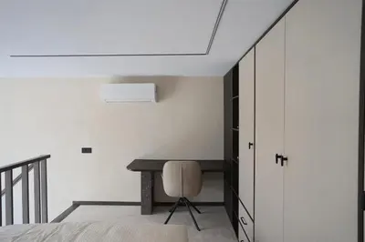 a bedroom with a desk and a bed with a chair at Vilnius Luxury Appartement in Vilnius