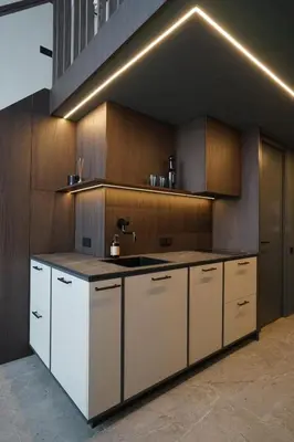a kitchen with white cabinets and a sink at Vilnius Luxury Appartement in Vilnius