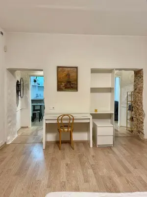 a white desk with a chair in a room at Domillion 1bdr Quiet City Hall apt D1115 in Vilnius