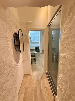 a view of a hallway with a mirror on the wall at Domillion 1bdr Quiet City Hall apt D1115 in Vilnius
