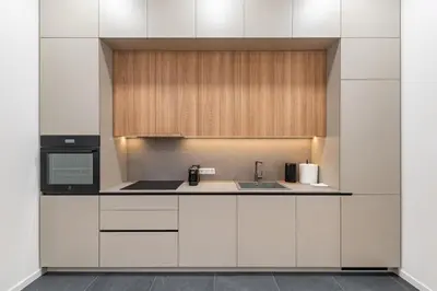 a kitchen with white cabinets and a sink at Vytauto 43 Residence 9 by Domvia in Kaunas