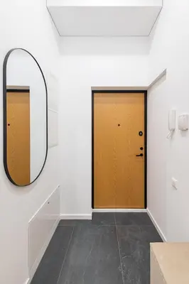 a hallway with two doors and a mirror at Vytauto 43 Residence 9 by Domvia in Kaunas