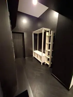an empty room with a shelf and a ceiling at Kauno buzo namuciai in Kaunas