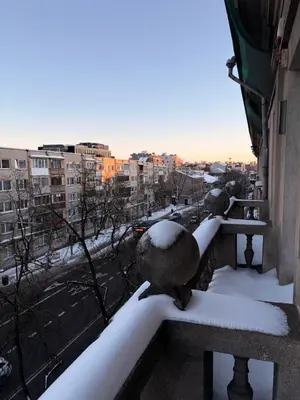a view of a city with snow on a balcony at Central Svitrigaila Apartments in Vilnius