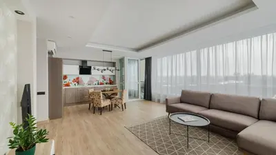 a living room with a couch and a table at Skyline View Apartment Vilnius in Vilnius