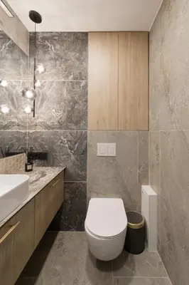 a bathroom with a toilet and a sink at Skyline View Apartment Vilnius in Vilnius