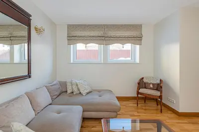 a living room with a couch and a glass table at Antique apartment by Polo Apartments in Kaunas