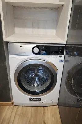 a washer and dryer sitting in a kitchen at Klevų 41 Townhouse, Noreikiskes in Kaunas
