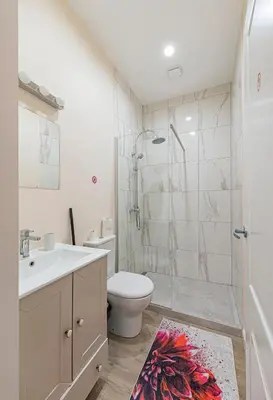 a bathroom with a sink toilet and a shower at Studio apartment Delight by Polo Apartments in Kaunas