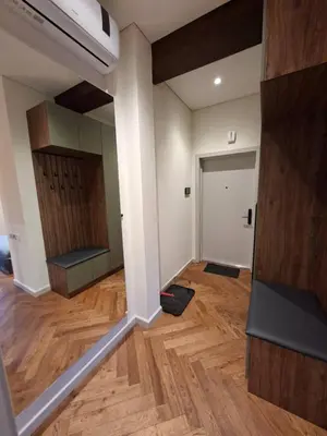 an empty room with a door and a wooden floor at Viktor Nemuno house in Kaunas
