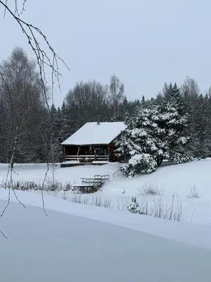 a cabin covered in snow in a snow covered field at Privatus namelis gamtoje greta Trakų in Daugirdiškės