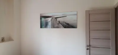 a picture hanging on a wall in a room at Kęstučio 66 apartamentai in Kaunas