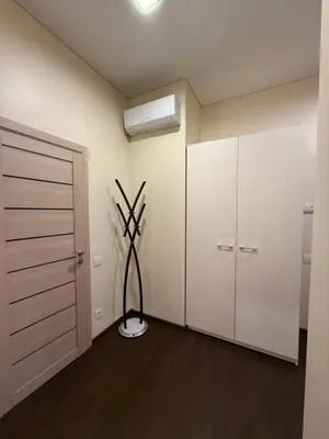 a room with a fan and a closet at Kęstučio 66 apartamentai in Kaunas