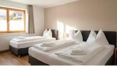 a room with two beds with white pillows at The Calm Place in Kaunas