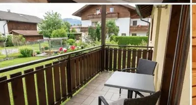 a patio with a table and chairs on a balcony at The Calm Place in Kaunas