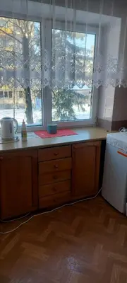 a kitchen with a counter with a window and a counter sidx sidx sidx at Flat 2 rooms in Panevėžys