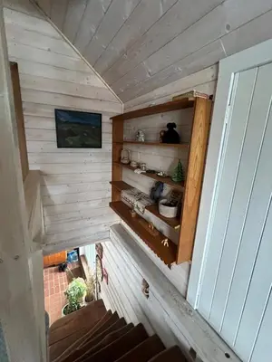 an overhead view of a tiny house with wooden walls at Sudervės pirtelė poilsiui gamtoje, Vilnius už 12 km in Sudervė