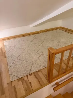an empty room with a rug on the floor at Cosy quiet apartment in the city center in Vilnius