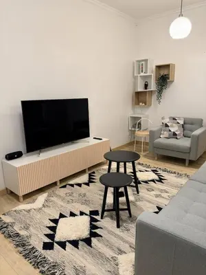 a living room with a large flat screen tv at Cosy quiet apartment in the city center in Vilnius