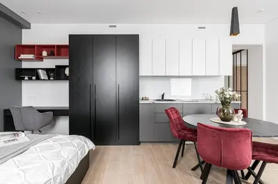 a kitchen and dining room with a table and chairs at Vilnius Studio Apartment with Free Parking and Self Check In in Vilnius